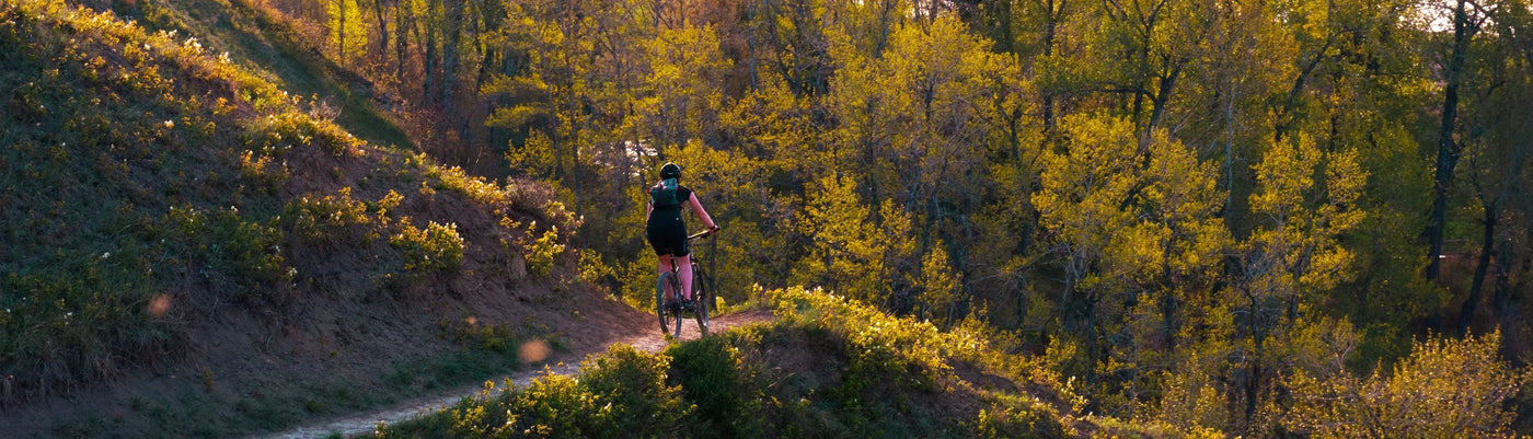 eBiker rider biking on forest trail in Calgary
