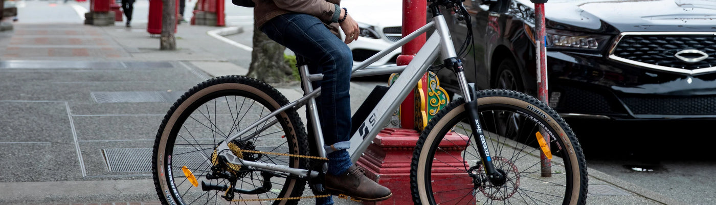 Individual riding eBike on sidewalk in Calgary