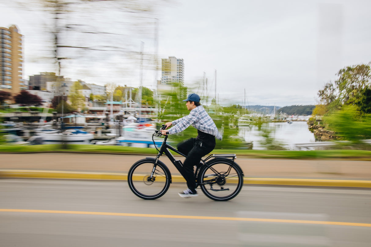 Surface 604 Colt 36V Version w/ High-Step Frame cruising in front of water front.