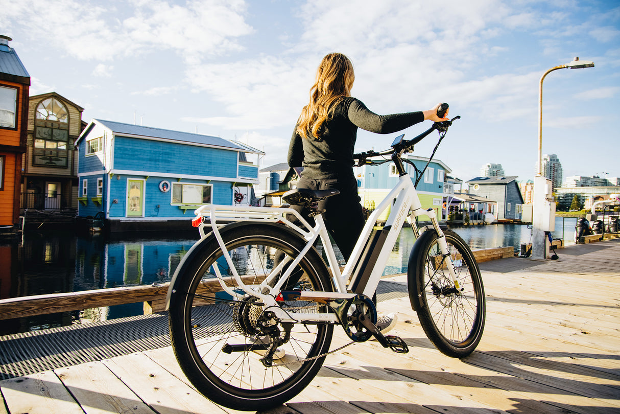 Surface 604 Rook Low-Step Commuter eBike being pushed on pier.