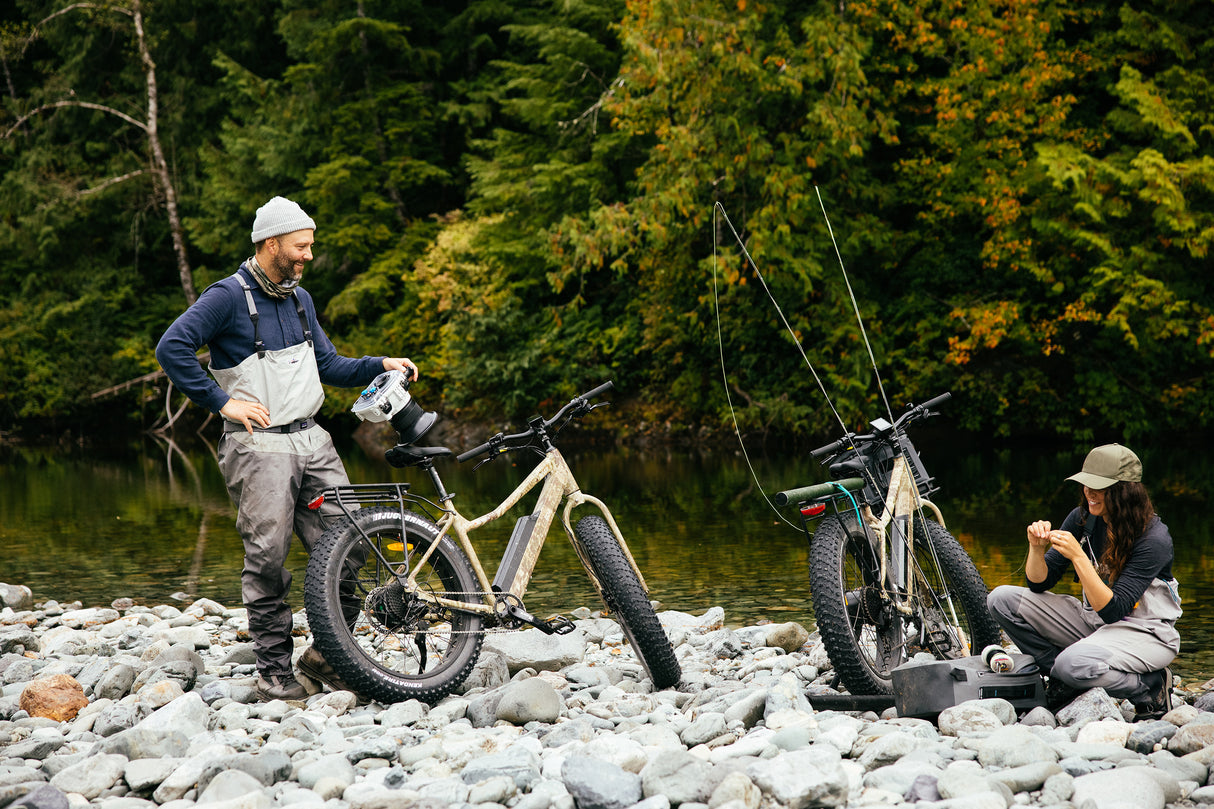 Surface 604 Boar Hunter Fat-Tire eBike with fishing equipment on a creekside