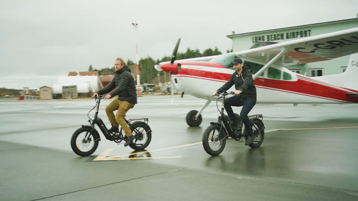 SURFACE604 - Twist Low Step 500W Folding been ridden in front of a airplane.