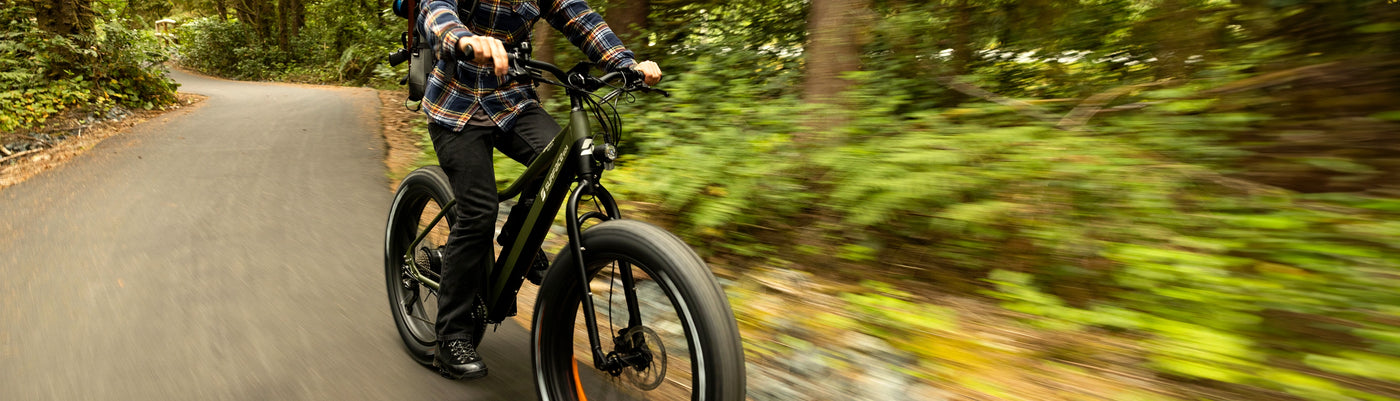 Person riding Surface 604 Fat Tire eBike Through Park 