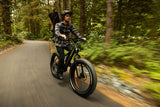 Surface 604 Boar Explorer Fat-Tire eBike being ridden through nature.