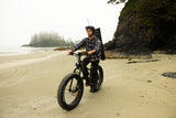 Surface 604 Boar Explorer Fat-Tire eBike being ridden on a foggy beach