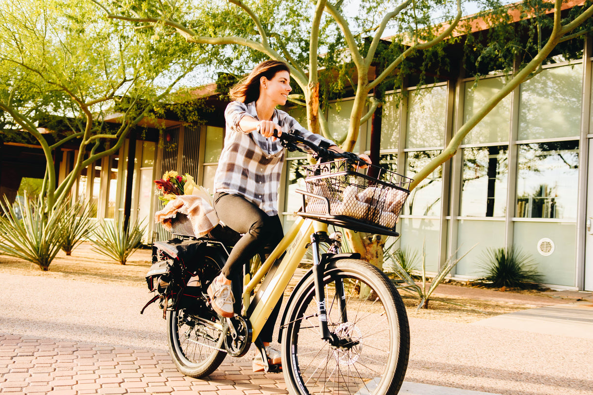 Surface 604 Werk Low-Step Commuter eBike being ridden down a street.